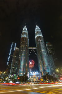 Illuminated modern buildings in city at night