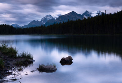 Scenic view of lake and mountains against sky