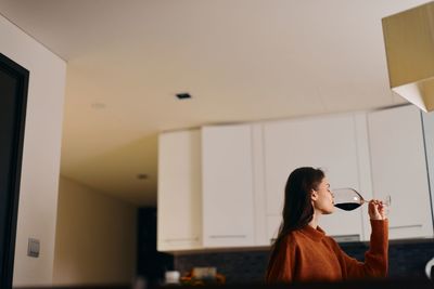 Side view of woman using mobile phone