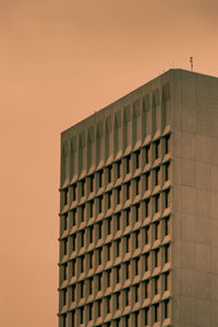 Low angle view of building against sky during sunset
