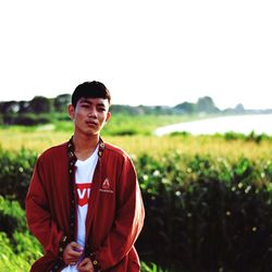 Young man standing on field