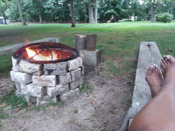 Low section of person relaxing in park