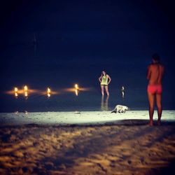 Full length of woman standing on beach