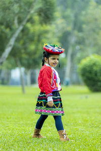 Cute girl standing on field