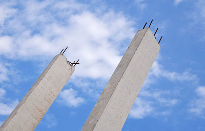 Low angle view of columns against sky