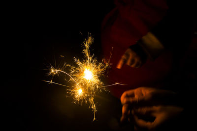Low angle view of firework display at night