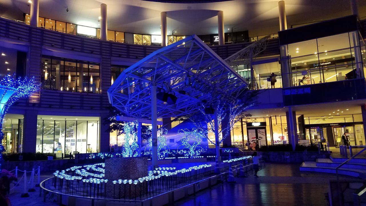 ILLUMINATED MODERN BUILDING INTERIOR WITH BLUE LIGHTS