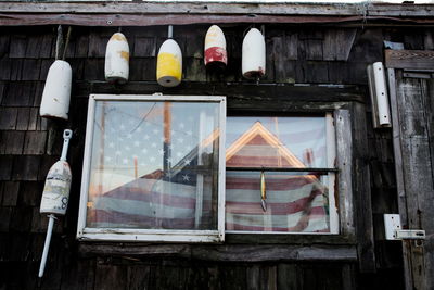 Reflection of old building on glass window