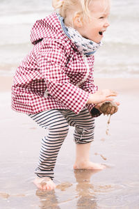 Full length of boy running on beach