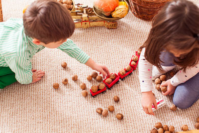 High angle view of girl playing with food