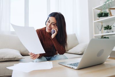 Young woman using laptop at home