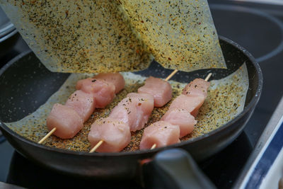 High angle view of meat in cooking pan