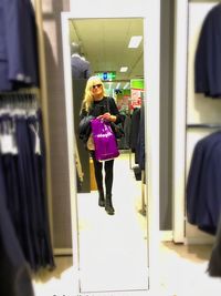 Full length of woman standing in store