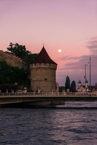 View of buildings at waterfront against sky