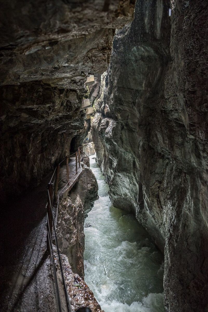 VIEW OF NARROW STREAM ALONG ROCKY LANDSCAPE