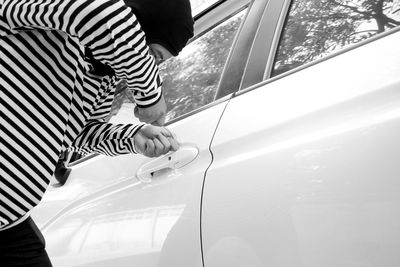 Thief breaking car lock