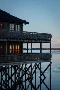 Pier over sea against clear sky