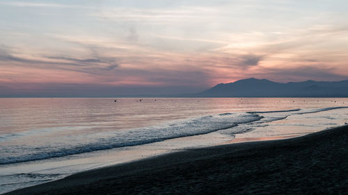 Scenic view of sea against sky during sunset