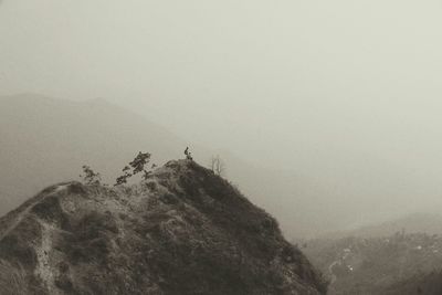 People standing in foggy weather