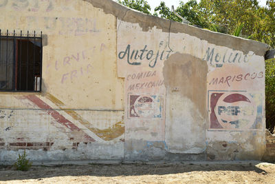 Graffiti on wall of old building