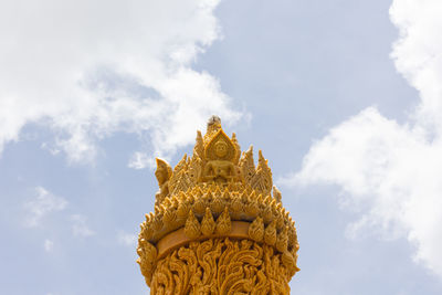 Low angle view of statue against sky