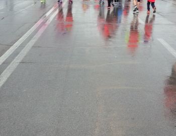 Blurred motion of people walking on road