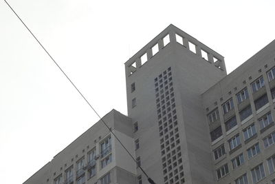 Low angle view of office building against sky