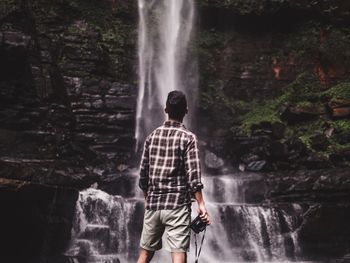 Man standing on rock formation