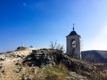 View of bell tower against blue sky