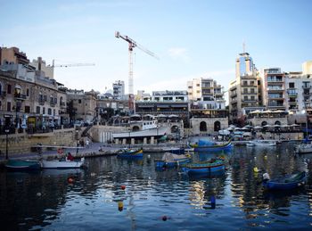 Boats moored at harbor