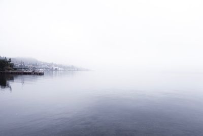 Scenic view of sea against sky during foggy weather