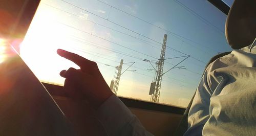 Low angle view of silhouette people against sky during sunset