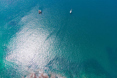 High angle view of sea against blue sky