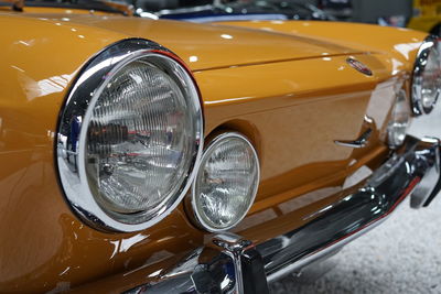 Close-up of vintage car on street