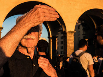 Portrait of man standing in city