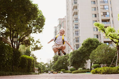 Side view of woman exercising on road