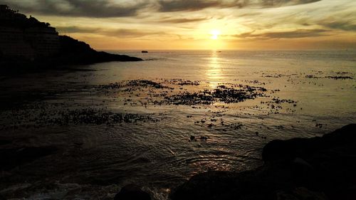 Scenic view of sea at sunset