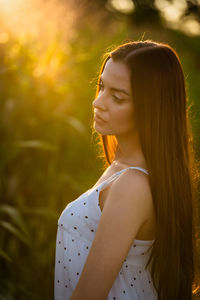 Portrait of young woman looking away