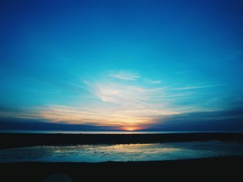 Scenic view of calm sea at sunset