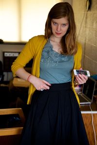 Portrait of a woman sitting on seat at home