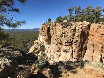 Rock formations on mountain against clear sky