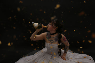 Young woman holding trophy