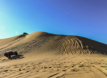 Scenic view of desert against clear sky