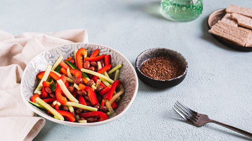 Vegetarian salad of red beans, cucumber and bell pepper in a bowl on the table web banner