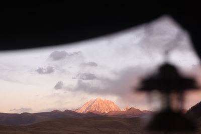 Scenic view of mountains against sky during sunset