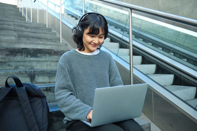 Young woman using laptop