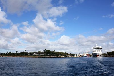 Scenic view of river against sky in city