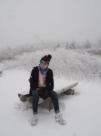 Full length of man on snow covered field