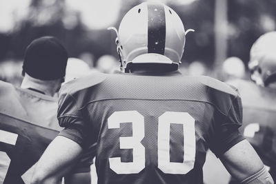 Rear view of american football players