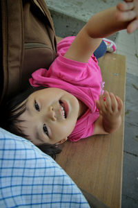 Portrait of cute girl holding pink flower